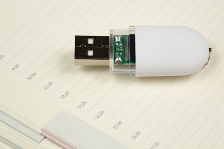 White pendrive and deily schedule