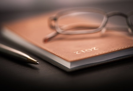 Detail of an agenda on the tableの写真素材