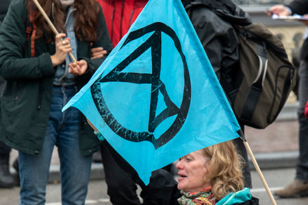 One Of The Last Protesters At The Blauwebrug At The Climate Demonstration From The Extinction Rebellion Group At Amsterdam The Netherlands 2019のeditorial素材