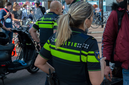 Backside Of A Police Woman At Amsterdam The Netherlands 2019のeditorial素材