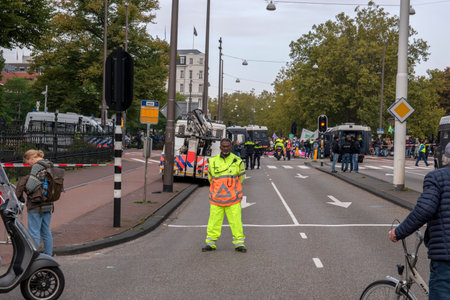 One Crowd Supporter And BOA Employees At Work During The Rebellion Extinction Group Demonstration At Amsterdam The Netherlands 2019のeditorial素材
