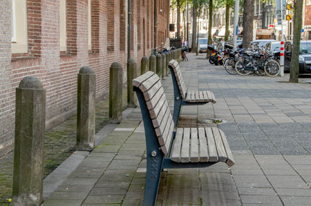 Empty Benches At The Nieuwezijds Voorburgwal Street At Amsterdam The Netherlands 2018のeditorial素材