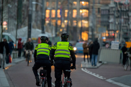 Police Men On Bicycles At Night Amsterdam The Netherlands 2019のeditorial素材