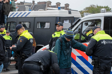 Group Of Police Men At The Blauwebrug At The Climate Demonstration From The Extinction Rebellion Group At Amsterdam The Netherlands 2019のeditorial素材