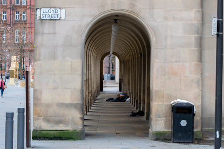 Homeless Man Sleeping At The Central Library Manchester England 2019のeditorial素材