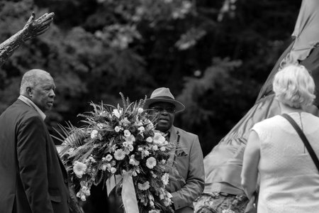 Group Of FNV Representatives Placing Wreaths At The National Slavery Monument At The Keti Koti Festival At Amsterdam The Netherlands 02/07/2020のeditorial素材