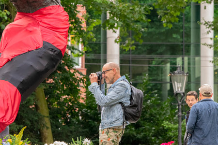 Man Taking Pictures At The National Slavery Monument At The Keti Koti Festival At Amsterdam The Netherlands 02/07/2020のeditorial素材