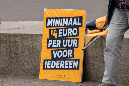 Poster At The Demonstration For A 14 Euro Wages At Amsterdam The Netherlands 7/1/2020のeditorial素材