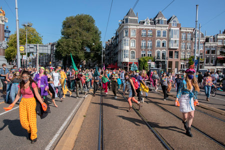 Dancing During The Rebellion Extinction Demonstration At The Blauwebrug Bridge At Amsterdam The Netherlands 20-7-2020のeditorial素材