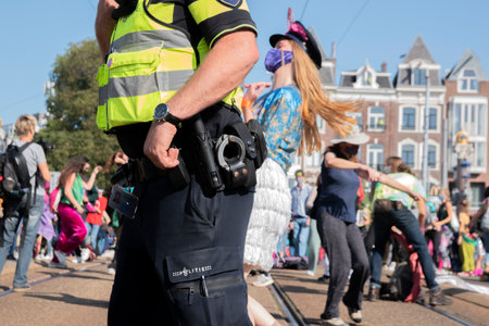Police At Work During The Extinction Rebellion Group Dancing At The Blauwbrug Bridge At Amsterdam...