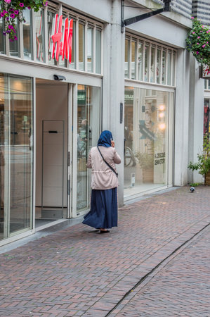 Muslim Woman At The H&M Shop At Amsterdam The Netherlands 2018のeditorial素材