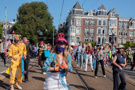 Rebellion Extinction Demonstrators Dancing At The Blauwbrug Bridge At Amsterdam The Netherlands...