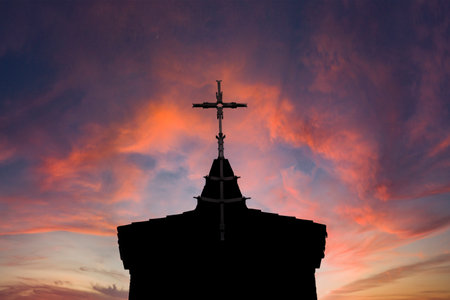 Close Up Cross In A Church With Red Skyの写真素材