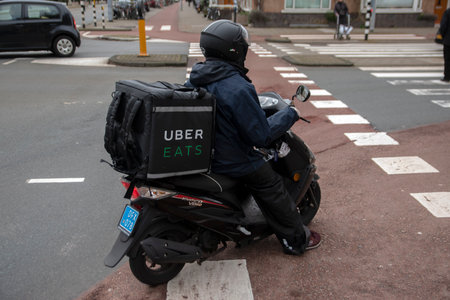 Uber Scooter Delivery At Amsterdam The Netherlands 20-1-2021のeditorial素材