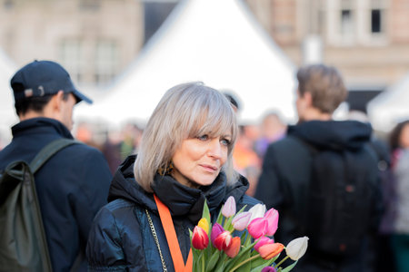 Woman With Tulips On Tulips Day At Amsterdam The Netherlands 18-1-2020のeditorial素材