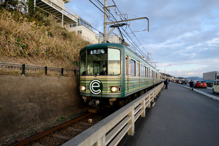 Kamakura, Kanagawa, Japan-Dec.2019: Train of the Enoshima Electric Railway. Perspectiveのeditorial素材