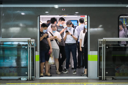 Shanghai,China-July 2020: passengers in face mask to prevent covid-19 coronavirus, standing inside...