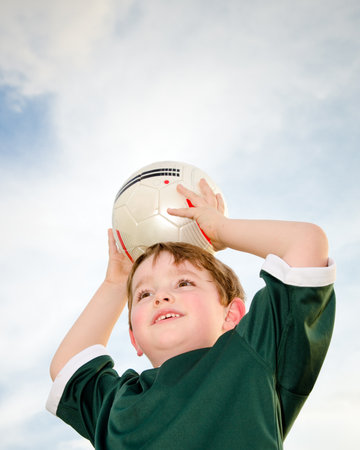 Young boy playing soccerの写真素材