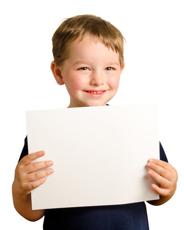 Cute young happy preschooler boy holding up blank sign with room for copy isolated on whiteの写真素材