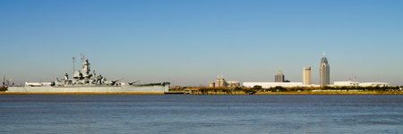 Panoramic of Mobile, Alabama, skyline with U.S.S. Alabama in foreground on Mobile Bayの写真素材