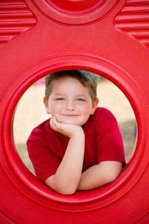 Portrait of young child playing on playground の写真素材