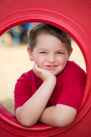 Portrait of young child playing on playground の写真素材