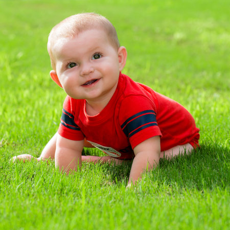 Smiling happy cute baby outdoorsの写真素材