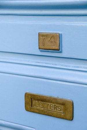 An old fashioned brass letterbox at number 74の写真素材