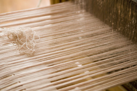 A Close Up Of A Weaving Loom