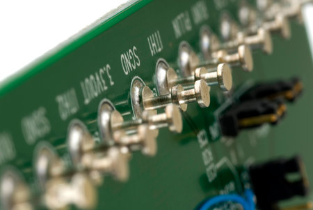 Close up detail of a Printed Circuit Board on a white background