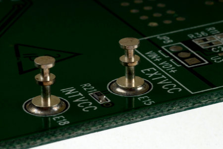 Close up detail of a Printed Circuit Board on a white background