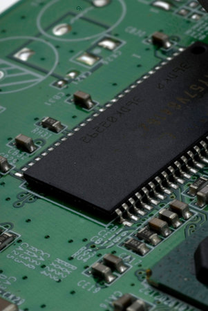 Close up detail of a Printed Circuit Board on a white background