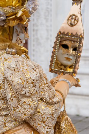 Beautiful coloured image of the fantastic costumes on display on the streets of Venice during carnivalの写真素材