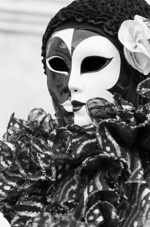 Beautiful coloured image of the fantastic costumes on display on the streets of Venice during carnivalの写真素材