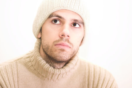 Man with hat looking up. Very shallow DOF with focus on eyes.の写真素材