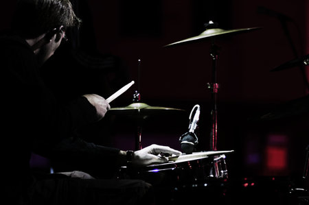 Shot of a drummer on live concert. Artistic lookの写真素材