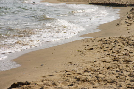Sea waves and sand beachの写真素材