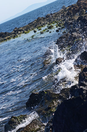 Sea waves captured at slow shutter speed in order to get dreamy milky feel.の写真素材
