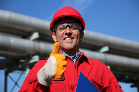 Smiling Industrial Worker Giving Thumb Upの写真素材