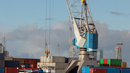 Cargo Freight Ship with Stacked Container at Harbor Terminal