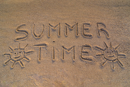 In the picture the words on the sand "Summer time"の写真素材