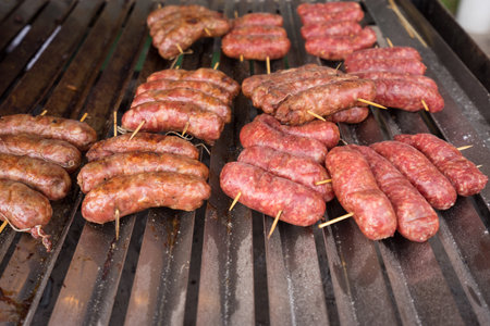 Cooking sausage at barbecue outdoor,Shallow depth of field.の写真素材