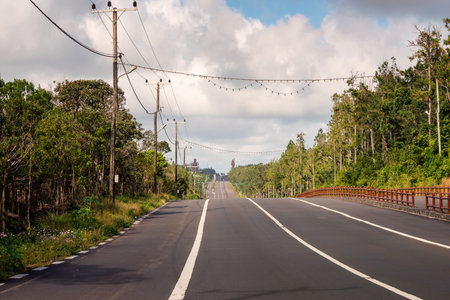 A big road to Grand Bassin lake at mauritius,background two huge staue of hindu religion.の写真素材