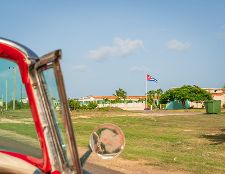 Cuba Varadero, view inside an old vintage classic american car on the right Cuban flag,sunny day.の写真素材