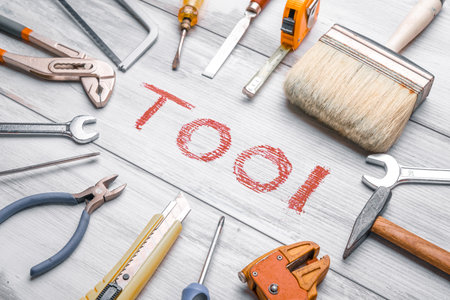 Set of work tools on rustic wooden background with writtenの写真素材