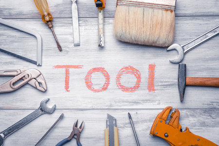Set of work tools on rustic wooden background with writtenの写真素材