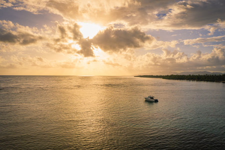 Luxury boat anchored close to exotic tropical beach..Aerial view at sunset of Samana peninsula in Dominican republic.の写真素材