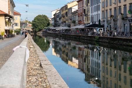 Milan, Italy-september 29,2020: People walk with surgical mask for pandemic situation near the Naviglio Pavese Canal in Milan, Italy.のeditorial素材
