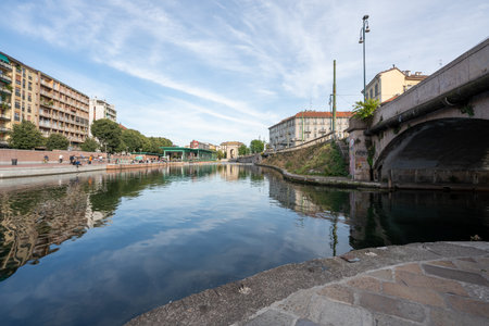Milan, Italy-september 29,2020: People walk along the shore of the Naviglio Milanese canal and relax in the bars during the coronavirus pandemic (Covid-19) Darsena area, Milan Italy.のeditorial素材