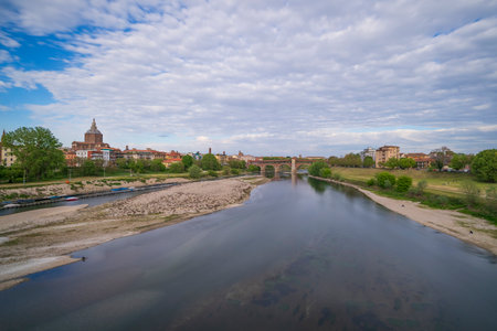 Skyline of Pavia , Ponte Coperto(covered bridge) is a bridge over the Ticino river in Pavia at sunny day, Pavia Cathedral background, Italyの写真素材